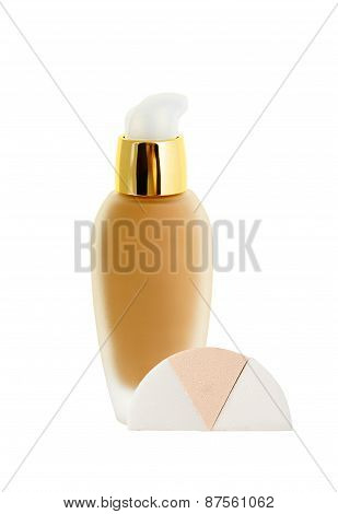 Cosmetic Liquid Foundation And Sponges Isolated On White