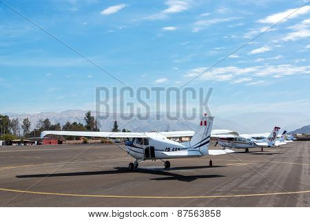 NAZCA PERU - OCTOBER 26: Airplanes at Maria Reiche Neuman Airport in Nazca Peru waiting to take tourists over the Nazca Lines on October 26 2014