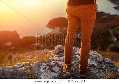Men's legs on the mountain