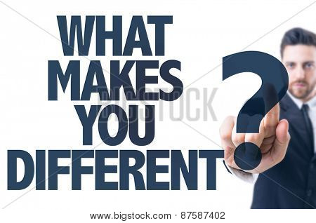 Business man pointing the text: What Makes You Different? 