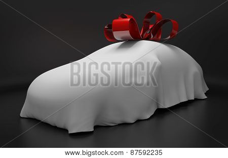 Auto concept of a new covered sports car topped with a red ribbon as a gift