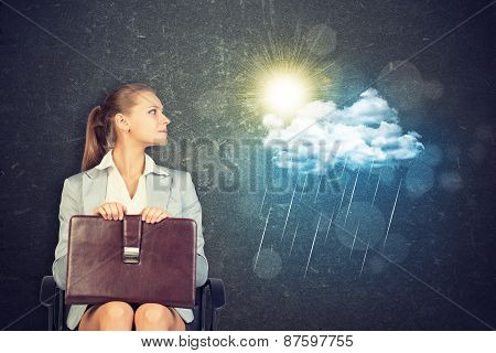 Businesswoman with Case Looking at Rain Cloud