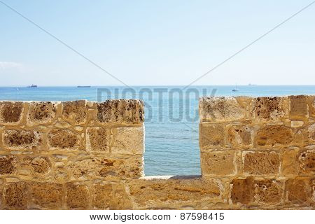 Limestone fort wall close-up. Sea view.