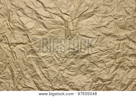 Close-up Of Rough Golden Brown Wrinkled Packaging Paper Texture Background