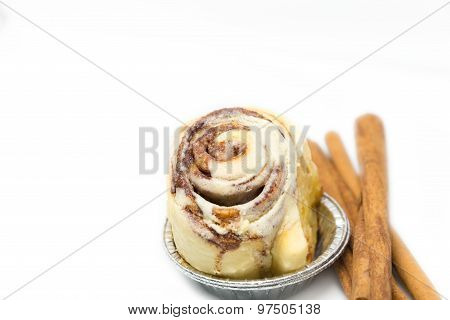 Mini Cinnamon Roll With Cinnamon Stick Isolated
