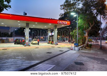 HONG KONG - FEBRUARY 04, 2015: Caltex fuel station at evening. Caltex is a petroleum brand name of Chevron Corporation used in more than 60 countries