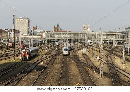 MUNICH, GERMANY - JULY 3, 2015: Central railway station in Munich with arriving / leaving trains and a lot of rail tracks picture was taken from the Hackerbruecke