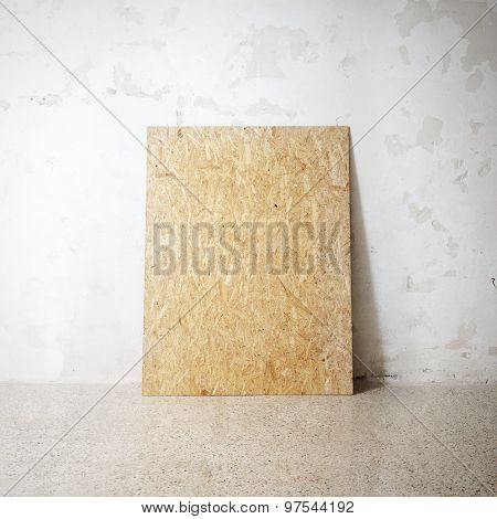 Blank wooden natural frame on a cocrete wall