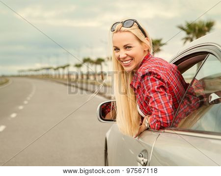 Young Woman Auto Traveler On The Highway