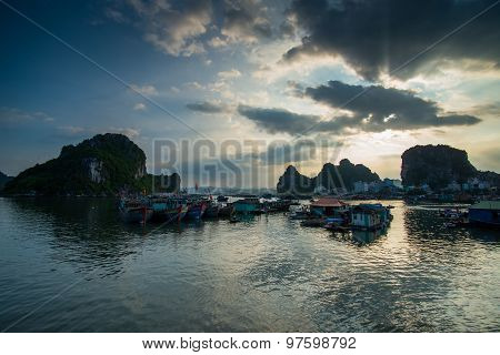 Beautiful seascape with boats in sunset in Halong bay