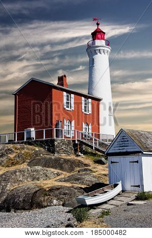 Fisgard Lighthouse, Victoria, Canada: It's night work done, the lighthouse braces itself against a morning sun and a looming change of weather.