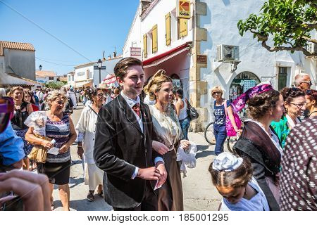 Saintes-Maries-de-la-Mer, Provence, France - May 25, 2015. The concept of ethnographic tourism. Participants in a procession in ancient dresses. Religious feast in honor of the Holy Maries in Provence