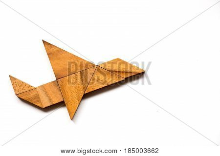 Wooden tangram puzzle in airplane shape on white background (Concept for new experience start project)