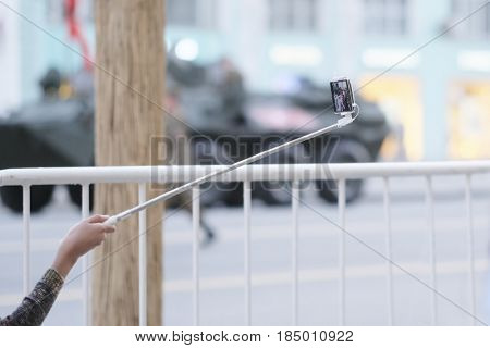 Moscow, Russia - May, 3, 2017: Somebody makes selfie during parade repetition on Tverskaya street in a center of Moscow