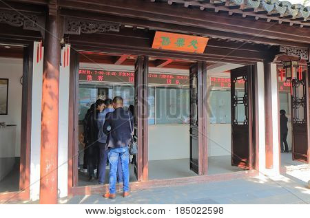 SUZHOU CHINA - NOVEMBER 3, 2016: Unidentified people buy admission for Lion Forest Garden. Lion Forest Garden is recognized with other classical gardens in Suzhou as a UNESCO World Heritage Site.