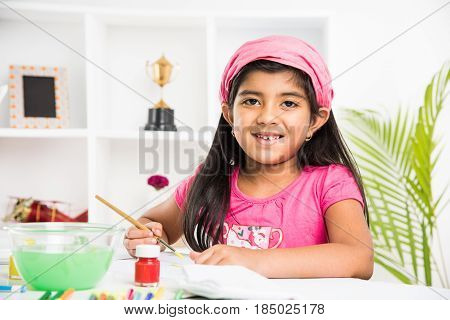 indian girl drawing, indian girl painting,asian girl colouring or drawing with sketch pen, indian girl and art and craft