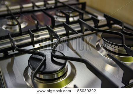 Close up black burner on modern kitchen stove
