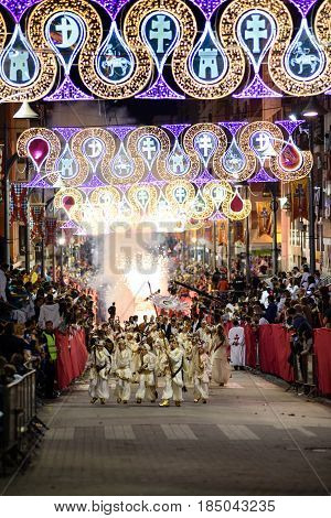 Caravaca de La Cruz, Spain - May 4: 2017. On May 4th, the Grand Parade takes place, in which Moorish and Christians wear their best clothes raising the public of their tribunes to the rhythm of Moors and Christians marches