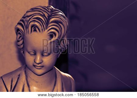 Sad statue, as a symbol of depression and despair.