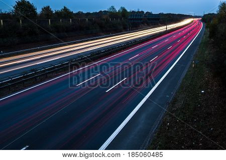 Highway at night with blurred car lights in a long exposure shot