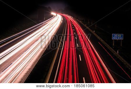 Highway at night with blurred car lights in a long exposure shot