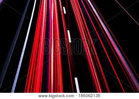 Highway at night with blurred car lights in a long exposure shot