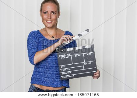 woman with clapperboard