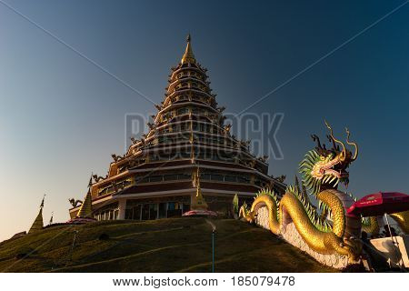 Golden Pagoda nine tier with dragon texture at Chinese temple - wat hyua pla kang temple, Chiang Rai, northern of Thailand, one of the most beautiful popular temples in Thailand