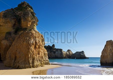 View of the scenic Praia dos Tres Irmaos in Alvor Algarve Portugal; Concept for travel in Portugal and explore Algarve