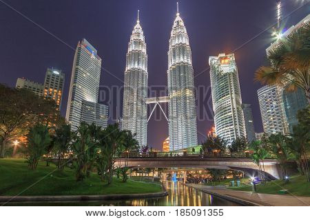 KUALA LUMPUR, MALAYSIA - AUGUST 13: Petronas Twin Towers at night on August 13, 2016 in Kuala Lumpur. Petronas Twin Towers were the tallest buildings (452 m) in the world from 1998 to 2004.
