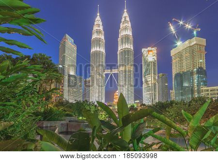 KUALA LUMPUR, MALAYSIA - AUGUST 13: Petronas Twin Towers at night on August 13, 2016 in Kuala Lumpur. Petronas Twin Towers were the tallest buildings (452 m) in the world from 1998 to 2004.