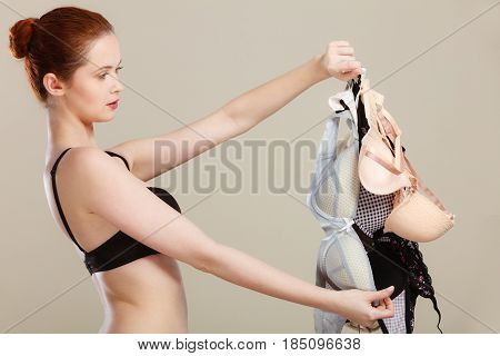 Woman Choosing Bras To Wear