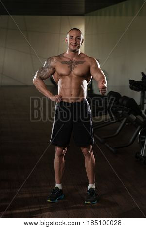 Muscular Man Showing Thumbs Up