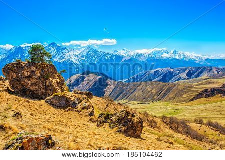 Beautiful Landscape Of Caucasus Mountains With Clouds And Blue Sky, Russia, Republic Ingushetia