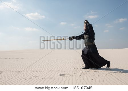Warrior In Traditional Armor For Kendo - Bogu , Makes A Swift Attack