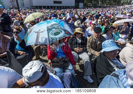 Fatima Portugal - May 13 2014: Crowd of people at the Sanctuary of Fatima during the celebrations of the apparition of the Virgin Mary in Fatima Portugal.
