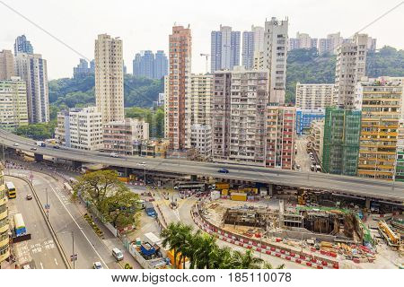 Old houses surrounded modern skyscrapers in Hong Kong. Hong Kong is popular tourist destination of Asia and leading financial centre of the world.