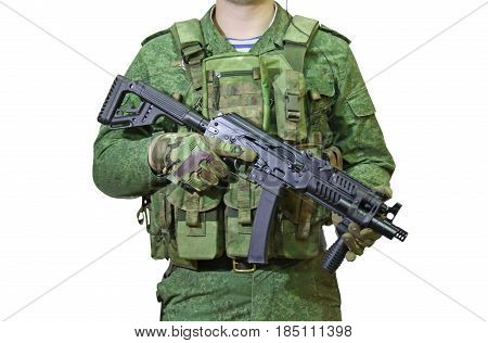 Soldier with a gun in the hands in the green uniform of the pixel