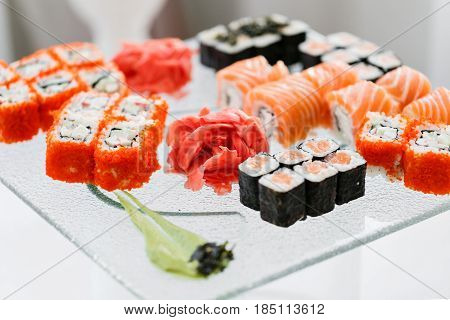 Japanese Cuisine -Buffet catering style Sushi Set in restaurant - salmon Maki Sushi and Nigiri Sushi