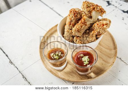 breaded mozzarella cheese stick finger bites snack food with salsa dips