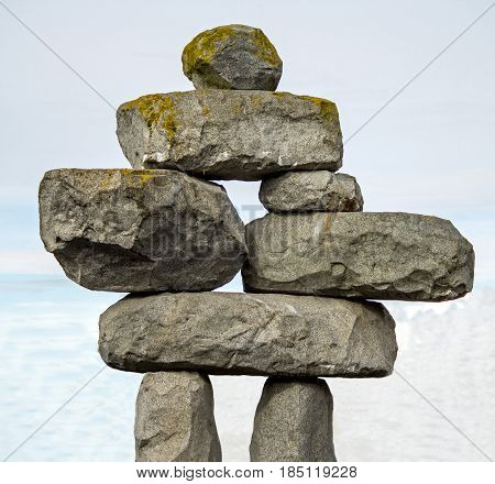 Inuksuk - A Stone Sculpture in the form of a person - along the road in Canada