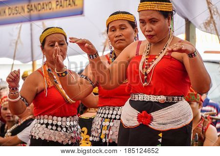 Penampang,Sabah-May 30,2016:Women of Sabah,Borneo Kadazandusun ethnic in their traditional costumes performs traditional dance during Harvest Festival at Penampang,Sabah,Malaysia