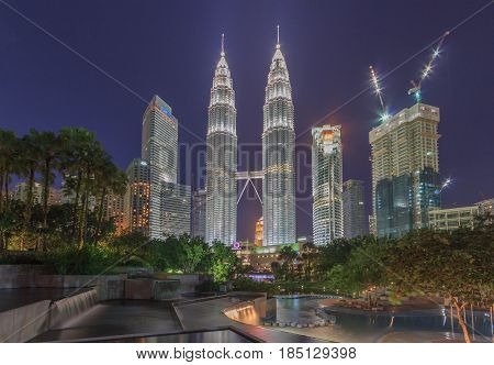 KUALA LUMPUR, MALAYSIA - AUGUST 13: Petronas Twin Towers in blue hour on August 13, 2016 in Kuala Lumpur. Petronas Twin Towers were the tallest buildings (452 m) in the world from 1998 to 2004