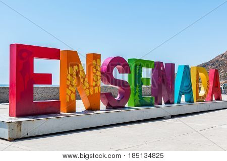 ENSENADA, MEXICO - MAY 3, 2017:  The city name of Ensenada greets visitors in giant colorful letters on arrival to this coastal city, which is the third largest in Baja California.