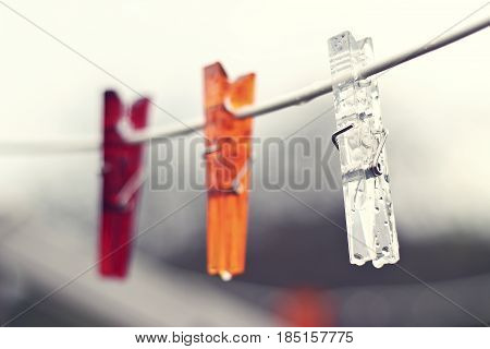Clothes pegs outdoor in the summer rain