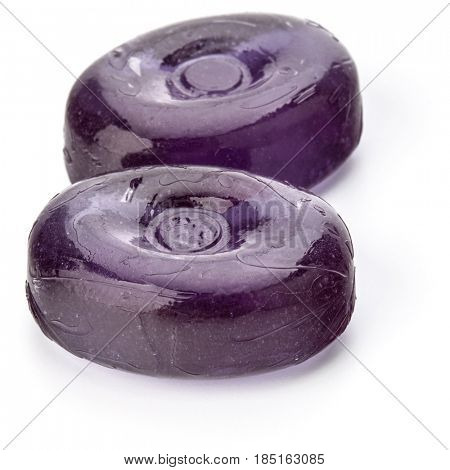 Two colorful fruit hard sugar candies,  boiled sweeties or sugar plums isolated on white background cutout