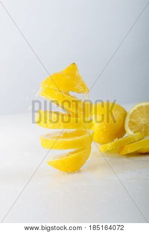 Flying Lemon. Sliced Lemon On White Background. Levity Fruit Floating In The Air.