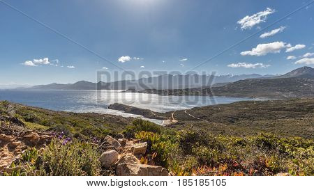 View Of Calvi Citadel And Mountains From Revellata In Corsica