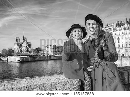 Mother And Daughter Travellers In Paris Showing Thumbs Up