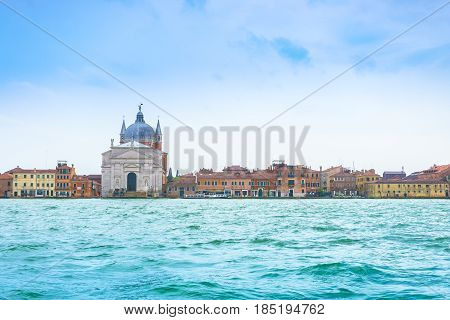Venice Italy - April 27 2017: Beautiful canal church and Venice residential style beside Grand Canal in Venice Italy.
